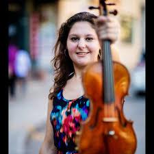 Photo of Ilana Zaks holding a violin