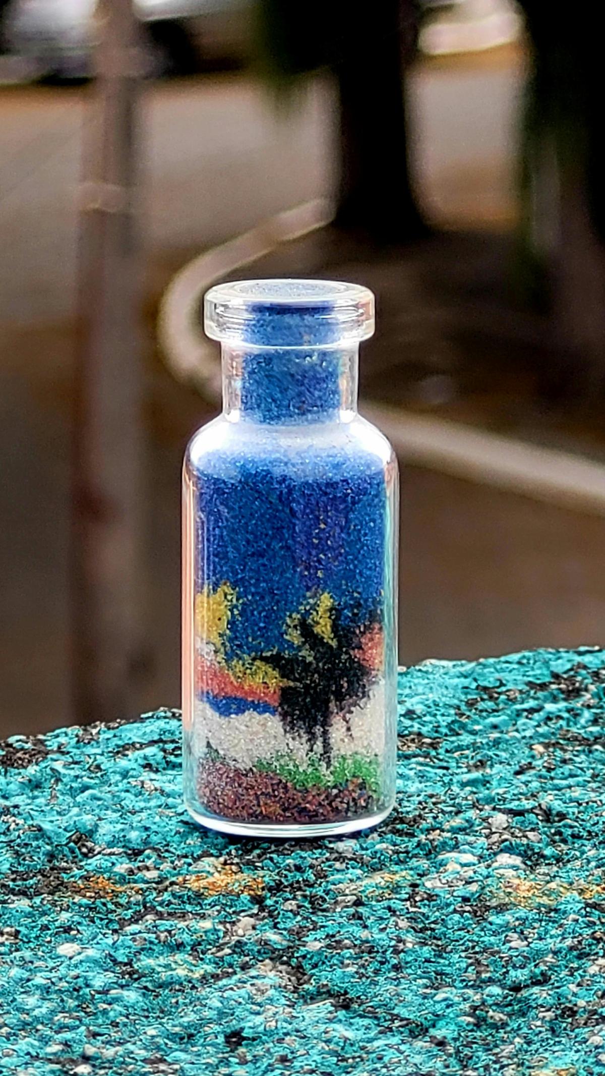 Colorful sand in a small bottle