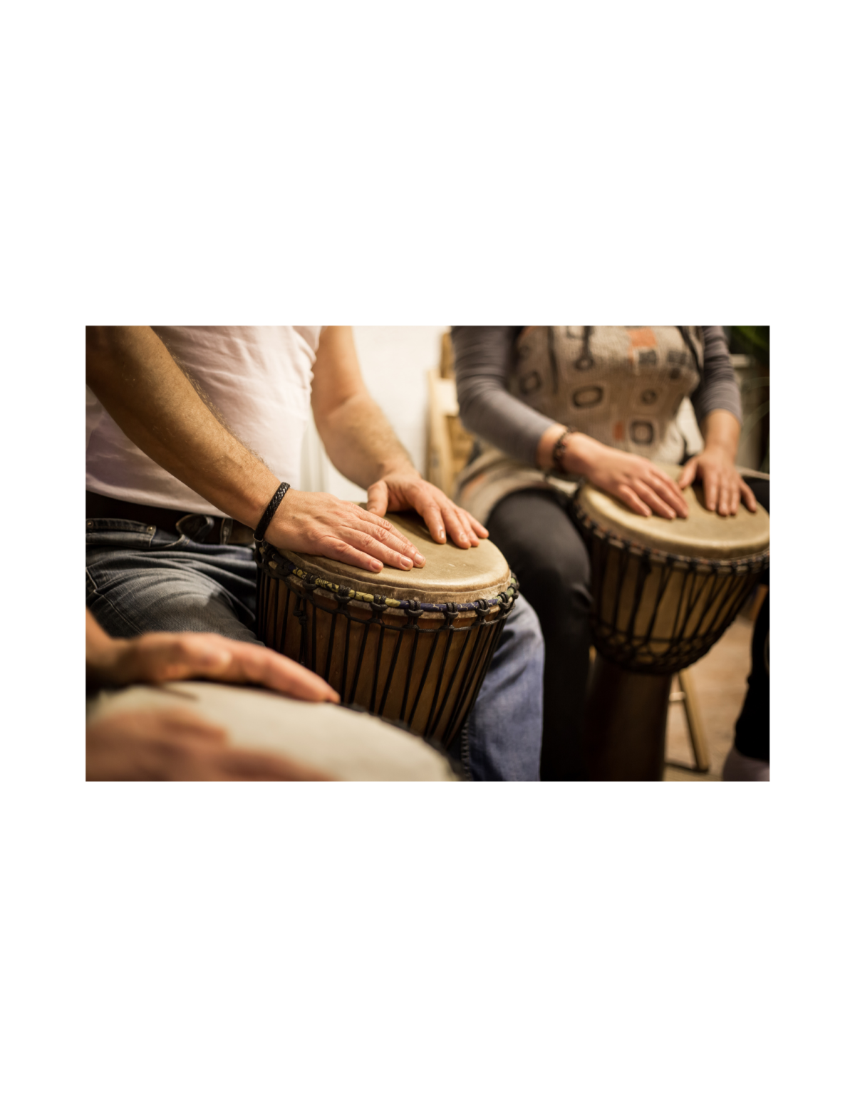 Hands playing drums.
