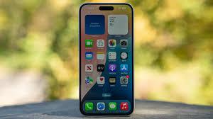 iPhone standing upright on outdoor table.